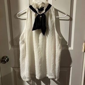 Sleeveless baby doll top, high collar, black satin bow. Size large